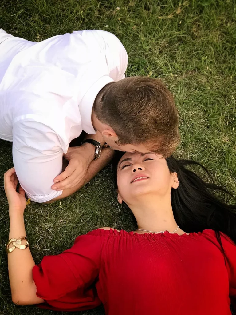 Couple lying on grass