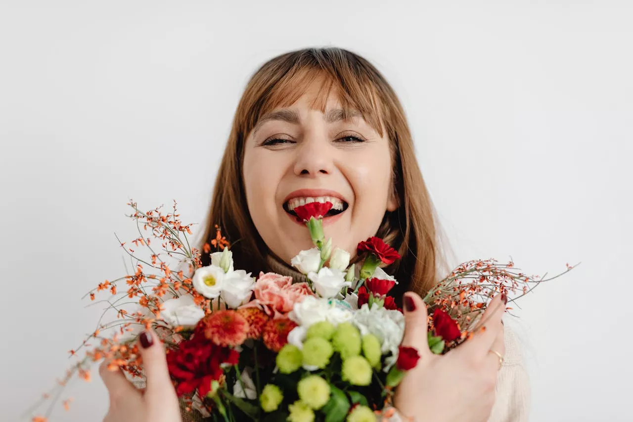 a woman holding flowers